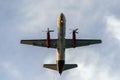 Dual propeller cargo aircraft flying over you