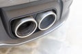 A dual sports car exhaust Royalty Free Stock Photo