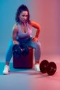 Dual toning blue red of young woman plus size doing fitness Royalty Free Stock Photo