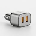 Dual usb car charger adapter for fast mobile device charging on the go white background Royalty Free Stock Photo