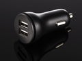 Dual usb car charger over black background Royalty Free Stock Photo