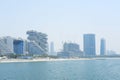 Dubai Beachfront Skyline Under Hazy Sky. Dubai, UAE - August 15, 2023 Royalty Free Stock Photo