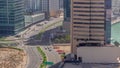 Dubai business bay district with office skyscrapers and traffic on the road intersection aerial all day timelapse. Royalty Free Stock Photo