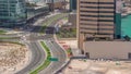 Dubai business bay district with office skyscrapers and traffic on the road intersection aerial all day timelapse. Royalty Free Stock Photo