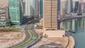 Dubai business bay district with office skyscrapers and traffic on the road intersection aerial timelapse. Royalty Free Stock Photo