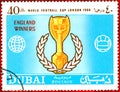 Postage stamp printed in Dubai with a picture of a football cup, with the inscription `World Football Cup London 1966` Royalty Free Stock Photo