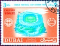 Postage stamp printed in Dubai with a picture of a stadium, with the inscription `World Football Cup London 1966`