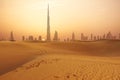 Dubai city skyline at sunset seen from the desert Royalty Free Stock Photo