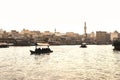 Dubai Creek with abra boats. Local people and tourists using water taxi and ferry in old town river. Traditional cruise. Royalty Free Stock Photo