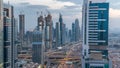 Dubai downtown architecture day to night timelapse. Top view over Sheikh Zayed road with illuminated skyscrapers and Royalty Free Stock Photo