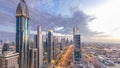 Dubai downtown architecture day to night timelapse. Top view over Sheikh Zayed road with illuminated skyscrapers and Royalty Free Stock Photo