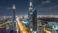 Dubai downtown architecture night timelapse. Top view over Sheikh Zayed road with illuminated skyscrapers and traffic. Royalty Free Stock Photo