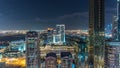 Dubai downtown architecture night timelapse. Top view over Sheikh Zayed road with illuminated skyscrapers and traffic. Royalty Free Stock Photo