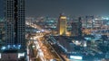 Dubai downtown architecture night timelapse. Top view over Sheikh Zayed road with illuminated skyscrapers and traffic. Royalty Free Stock Photo