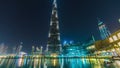 Dubai downtown and Burj Khalifa timelapse near lake with musical fountain