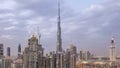 Dubai Downtown day to night timelapse. Aerial view over big futuristic city by night. Royalty Free Stock Photo