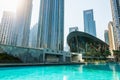 Dubai downtown modern skyscrapers on the water canal at sunny day. Dubai, United Arab Emirates