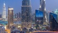 Dubai downtown skyline day to night with tallest building and Sheikh Zayed road traffic, UAE Royalty Free Stock Photo