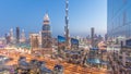 Dubai downtown skyline day to night with tallest building and Sheikh Zayed road traffic, UAE Royalty Free Stock Photo