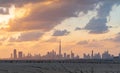 Dubai Downtown skyline with desert sand, United Arab Emirates or UAE. Financial district and business area in smart urban city.