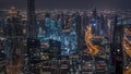 Dubai Downtown skyline futuristic cityscape with many skyscrapers and Burj Khalifa aerial night to day timelapse. Royalty Free Stock Photo