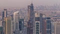 Dubai Downtown skyline futuristic cityscape with many skyscrapers and Burj Khalifa aerial timelapse.