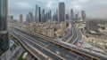 Dubai downtown skyline night to day aerial timelapse with traffic on highway Royalty Free Stock Photo