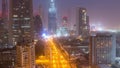 Dubai downtown skyline night to day aerial timelapse with traffic on highway Royalty Free Stock Photo