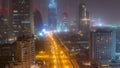 Dubai downtown skyline night to day aerial timelapse with traffic on highway Royalty Free Stock Photo