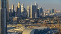 Dubai downtown skyline timelapse at sunset time. Rooftop view of Sheikh Zayed road with numerous towers. Royalty Free Stock Photo