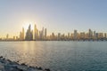 Dubai Downtown skyline with waves on sea beach, United Arab Emirates or UAE. Financial district in travel vacation concept. Urban Royalty Free Stock Photo