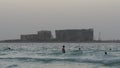 Dubai evening swimers with a palm hotel construction view 4k uae