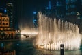 Dubai fountain with illumination at night. Popular tourist place in city downtown, UAE Royalty Free Stock Photo