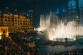 Dubai fountain with illumination at night. Popular tourist place in city downtown, UAE Royalty Free Stock Photo