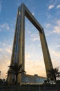 Dubai Frame the golden tower building at sunset. Dubai`s famous modern architecture on a cloudy blue sky background. Royalty Free Stock Photo