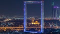 Dubai Frame with Zabeel Masjid mosque illuminated at night timelapse. Royalty Free Stock Photo