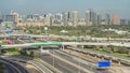 Dubai Golf Course with a cityscape of Gereens and tecom districts at the background aerial timelapse