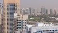 Dubai Golf Course with a cityscape of Gereens and tecom districts at the background aerial timelapse