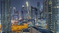 Dubai International Financial Centre district with modern skyscrapers night timelapse Royalty Free Stock Photo