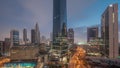 Dubai International Financial district aerial night to day timelapse. Panoramic view of business office towers. Royalty Free Stock Photo