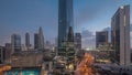 Dubai International Financial district aerial night to day timelapse. Panoramic view of business office towers. Royalty Free Stock Photo