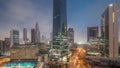 Dubai International Financial district aerial night to day timelapse. Panoramic view of business office towers. Royalty Free Stock Photo