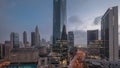 Dubai International Financial district aerial night to day timelapse. Panoramic view of business office towers. Royalty Free Stock Photo