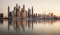 Dubai, January 13, 2023: Dubai Marina with skyline - luxury and famous Jumeirah beach frontline at sunrise, United Arab Emirates