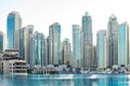 Dubai - January 20: Skyscrapers near the Dubai Fountain and Dubai Mall of the Emirates with water and reflections on January 20, 2