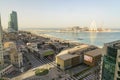 Dubai - January 30: Top view of Dubai Marina shopping mall, the walk and construction site of Dubai Eye ferris wheel on January 30