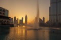 Dubai lagoon with fountain against sunset in UAE Royalty Free Stock Photo