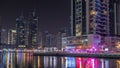 Dubai marina bay with yachts an boats night timelapse Royalty Free Stock Photo