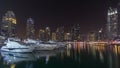 Dubai marina bay with yachts an boats night Royalty Free Stock Photo