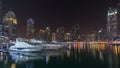 Dubai marina bay with yachts an boats night timelapse hyperlapse Royalty Free Stock Photo